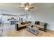 Comfortable living room with open kitchen access, modern lighting, and plenty of seating for relaxing and socializing at 17009 S Coleman St, Phoenix, AZ 85045