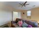Comfortable living room with a large couch and ceiling fan, great for relaxing at 17009 S Coleman St, Phoenix, AZ 85045