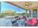 Covered patio with comfortable seating, a built-in barbecue, and a view of the pool at 17009 S Coleman St, Phoenix, AZ 85045