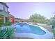 Backyard pool and spa are surrounded by desert landscaping and include a nearby patio area at 17009 S Coleman St, Phoenix, AZ 85045