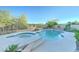 Backyard pool and spa are surrounded by desert landscaping and feature a basketball hoop at 17009 S Coleman St, Phoenix, AZ 85045