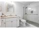 Renovated bathroom featuring a glass enclosed walk-in shower and granite countertop vanity at 1701 E Colter St # 151, Phoenix, AZ 85016