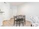 Cozy dining area with a sleek table and chairs, perfectly situated adjacent to the kitchen at 1701 E Colter St # 151, Phoenix, AZ 85016