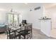 Comfortable dining area with sleek furniture, and a seamless transition to the living room and kitchen at 1701 E Colter St # 151, Phoenix, AZ 85016