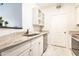 Elegant kitchen featuring granite countertops, white cabinets, and stainless steel appliances, seamlessly blending style and functionality at 1701 E Colter St # 151, Phoenix, AZ 85016