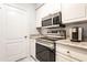 Well-equipped kitchen featuring granite countertops and stainless steel appliances at 1701 E Colter St # 151, Phoenix, AZ 85016