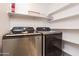 Modern laundry room with shelving and Samsung washer and dryer at 1701 E Colter St # 151, Phoenix, AZ 85016