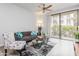 Inviting living room featuring a sliding glass door, comfortable seating, and tasteful contemporary decor at 1701 E Colter St # 151, Phoenix, AZ 85016