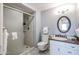 A bathroom featuring a shower and vanity with storage at 17238 N 107Th Ave, Sun City, AZ 85373