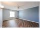 A large room with vinyl wood flooring and a ceiling fan at 17238 N 107Th Ave, Sun City, AZ 85373