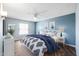 Beautiful bedroom with blue walls and patterned bedding at 17238 N 107Th Ave, Sun City, AZ 85373