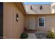 Inviting front entrance with stylish light fixture, security door, and tiled porch at 17238 N 107Th Ave, Sun City, AZ 85373