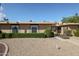 Charming home with desert landscaping and trimmed hedges in front of the property at 17238 N 107Th Ave, Sun City, AZ 85373