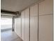 Spacious garage featuring wall-to-wall storage cabinets and an open garage door at 17238 N 107Th Ave, Sun City, AZ 85373