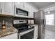 Close-up of kitchen appliances, cabinets, and countertops, showcasing modern upgrades at 17238 N 107Th Ave, Sun City, AZ 85373
