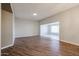Spacious living room boasts modern wood flooring and access to a bright sunroom at 17238 N 107Th Ave, Sun City, AZ 85373