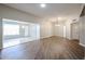 Spacious living room with seamless flow to the dining area, featuring modern flooring at 17238 N 107Th Ave, Sun City, AZ 85373