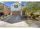 Charming two-story home with a well-maintained front yard and attached two-car garage at 20181 W Desert Bloom St, Buckeye, AZ 85326