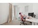 Bright bedroom with work space features a pink chair, white desk, and neutral curtains at 22499 E Mewes Rd, Queen Creek, AZ 85142