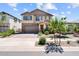 Charming two-story home with manicured landscaping and a welcoming entrance at 22499 E Mewes Rd, Queen Creek, AZ 85142