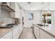 Modern kitchen featuring stainless steel appliances, ample counter space, and sleek cabinetry at 22499 E Mewes Rd, Queen Creek, AZ 85142