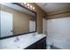 Full bathroom with a double sink vanity, shower, and tub combo at 25386 W Darrel Dr, Buckeye, AZ 85326