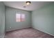 Neutral bedroom with carpet floors and a window with blinds at 25386 W Darrel Dr, Buckeye, AZ 85326