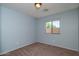 Blue painted bedroom with carpeted floors and a window for natural light at 25386 W Darrel Dr, Buckeye, AZ 85326