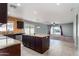 Open kitchen with tile flooring, center island, and stainless steel appliances at 25386 W Darrel Dr, Buckeye, AZ 85326