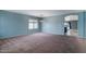 Spacious living room with carpeted floors and natural light at 25386 W Darrel Dr, Buckeye, AZ 85326