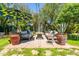 Inviting backyard patio with outdoor furniture, planters, and an umbrella for shade at 2908 E Pinchot Ave, Phoenix, AZ 85016