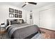 Cozy bedroom with ceiling fan, complemented by contemporary wall art at 2908 E Pinchot Ave, Phoenix, AZ 85016