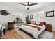 Comfortable bedroom with ceiling fan, a built-in desk area and stylish decor at 2908 E Pinchot Ave, Phoenix, AZ 85016