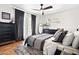 Comfortable bedroom featuring a ceiling fan, stylish decor, and a well-lit, inviting atmosphere at 2908 E Pinchot Ave, Phoenix, AZ 85016