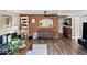 Cozy living room with brick accent wall, unique decor, hardwood floors, and a comfortable sofa setting the scene at 2908 E Pinchot Ave, Phoenix, AZ 85016