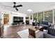 Bright living area with hardwood flooring, natural light, modern furniture, and a view of the backyard at 2908 E Pinchot Ave, Phoenix, AZ 85016