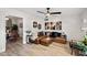 Inviting living room featuring modern decor, a leather sectional sofa, and hardwood floors at 2908 E Pinchot Ave, Phoenix, AZ 85016