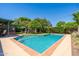 Backyard pool with pristine blue water and patio area with outdoor seating, perfect for relaxing and entertaining at 2908 E Pinchot Ave, Phoenix, AZ 85016