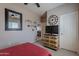 Bedroom featuring a bed, chest of drawers, and a large wall clock at 2911 W Keim Dr, Phoenix, AZ 85017