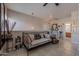 Comfortable bedroom features a daybed, tile flooring, a ceiling fan, and natural light at 2911 W Keim Dr, Phoenix, AZ 85017