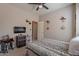 Comfortable bedroom featuring neutral walls, ceiling fan, TV, and stylish accents at 2911 W Keim Dr, Phoenix, AZ 85017