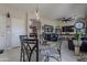 Open-concept dining area flowing into the living room with views of backyard and lots of light at 2911 W Keim Dr, Phoenix, AZ 85017