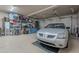 Spacious garage with storage shelves and a silver car at 2911 W Keim Dr, Phoenix, AZ 85017