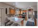 Well-equipped kitchen with wooden cabinetry, stainless steel appliances, and breakfast bar seating at 2911 W Keim Dr, Phoenix, AZ 85017
