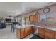 Well-lit kitchen featuring light wood cabinets, a dishwasher, and views to dining and living areas at 2911 W Keim Dr, Phoenix, AZ 85017
