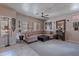Spacious living room featuring a comfortable sectional sofa, ceiling fan, and neutral decor at 2911 W Keim Dr, Phoenix, AZ 85017