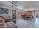 Open-concept living and dining area with a comfortable sectional, dining table, and stylish decor at 2911 W Keim Dr, Phoenix, AZ 85017
