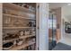 Well-organized pantry with shelving, providing plenty of storage space in the kitchen at 2911 W Keim Dr, Phoenix, AZ 85017