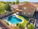 Aerial view featuring a backyard pool, shaded patio, and well maintained yard at 2930 E Quiet Hollow Ln, Phoenix, AZ 85024