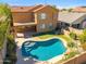 Aerial view of a backyard with a swimming pool, covered patio, and desert landscaping at 2930 E Quiet Hollow Ln, Phoenix, AZ 85024
